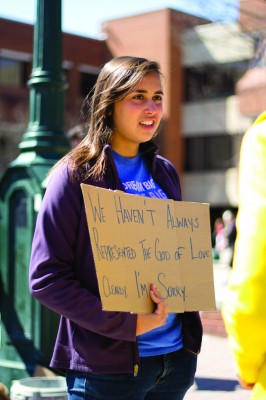  During Pride Week, students from Campus Crusade for Christ (CRU ) stood in North Plaza with signs apologizing for Christain treatment of the LGBTQ community. (Jenny Krashin/Broadside)